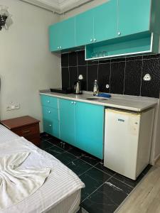 Kuchyň nebo kuchyňský kout v ubytování AWWA APART HOTEL