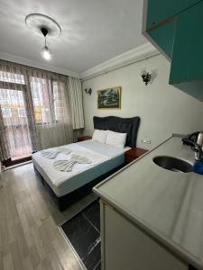 Postel nebo postele na pokoji v ubytování AWWA APART HOTEL