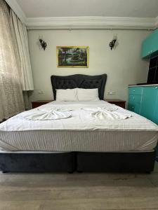 Postel nebo postele na pokoji v ubytování AWWA APART HOTEL
