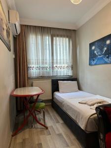 Postel nebo postele na pokoji v ubytování AWWA APART HOTEL