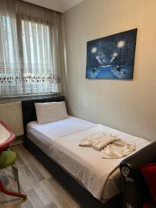 Postel nebo postele na pokoji v ubytování AWWA APART HOTEL