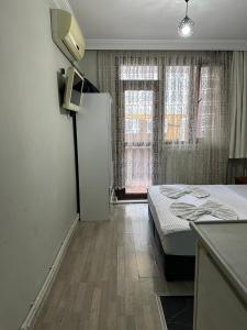 Postel nebo postele na pokoji v ubytování AWWA APART HOTEL