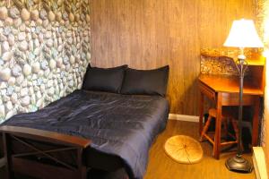 a bedroom with a bed and a desk with a lamp at Private 4 bedrooms 2 bathrooms Free Parking in Lower Sackville