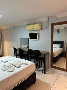 Postel nebo postele na pokoji v ubytování AWWA APART HOTEL
