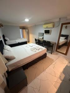 Postel nebo postele na pokoji v ubytování AWWA APART HOTEL