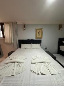 Postel nebo postele na pokoji v ubytování AWWA APART HOTEL