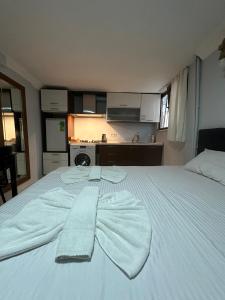Postel nebo postele na pokoji v ubytování AWWA APART HOTEL