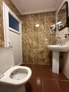 Koupelna v ubytování AWWA APART HOTEL