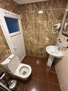 Koupelna v ubytování AWWA APART HOTEL