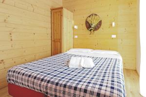 A bed or beds in a room at Borgo Stalle Residence