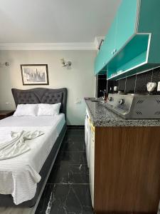 Postel nebo postele na pokoji v ubytování AWWA APART HOTEL