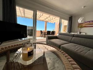 A television and/or entertainment centre at Diletta Beach Estepona