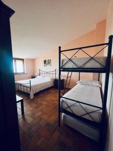 a room with two bunk beds in it at Tenuta Raimo in Altavilla Silentina