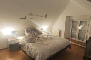 Postel nebo postele na pokoji v ubytování Gîte fleur du paradis