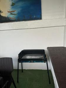 a bench in a room with a painting on the wall at Hotel California in Boracay +62 photos