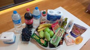 a table with a bunch of food and drinks on it at Taksim Perfect Residence, 3 bedrooms, pool, sauna, gym in Istanbul