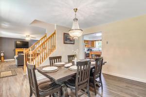 a dining room with a table and chairs at 7 Mi to Big Boulder Resort-Style Poconos Retreat in Albrightsville
