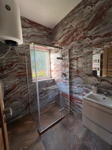 a bathroom with a shower and a sink at Penzión Stratenka in Stratená +23 photos