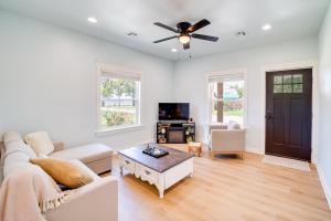 a living room with a couch and a ceiling fan at Eufaula Vacation Rental Walk to Lakeside Beaches! in Eufaula