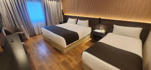 Cama ou camas em um quarto em Hotel Canal Beagle