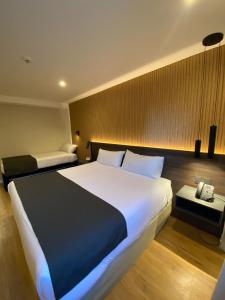Cama ou camas em um quarto em Hotel Canal Beagle