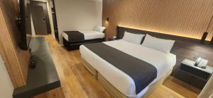 Cama ou camas em um quarto em Hotel Canal Beagle
