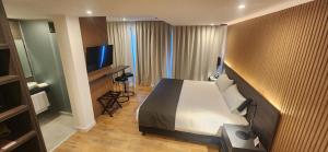 Cama ou camas em um quarto em Hotel Canal Beagle