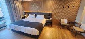 Cama ou camas em um quarto em Hotel Canal Beagle