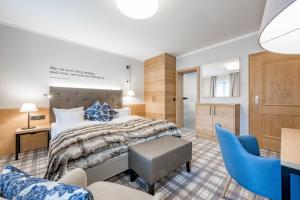 Postel nebo postele na pokoji v ubytování Ruhpoldinger Hof - Hotel & Wellness