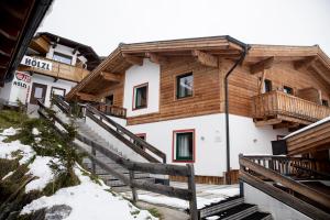 a building with a staircase in front of it at Chalet Central Top CC 6 in Königsleiten