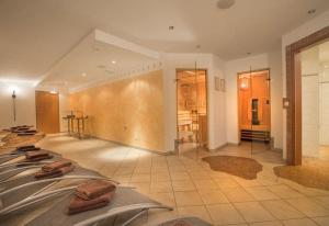 a room with four beds with towels on them at Chalet Central Top CC 7 in Königsleiten +2 photos