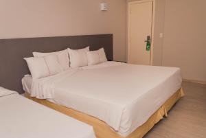 Cama ou camas em um quarto em Abba Hotel