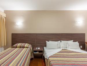 Cama ou camas em um quarto em Abba Hotel