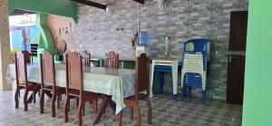 a dining room with a table and chairs at Casa de Alter in Alter do Chao