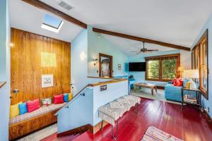 a living room with a couch and a table at Hanalei Waterfalls House TVNC #5120 in Hanalei