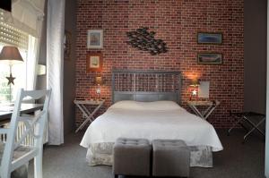 Letto o letti in una camera di Hôtel Vauban