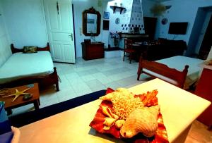 TV a/nebo společenská místnost v ubytování AGAPI apartments