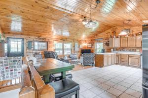 a kitchen and living room with a wooden ceiling at Picturesque Phoenix Vacation Home on Oswego River! in Phoenix