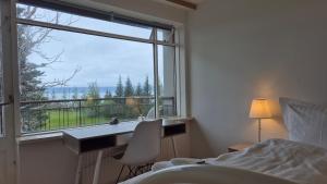 Postel nebo postele na pokoji v ubytování Húsavík Apartment