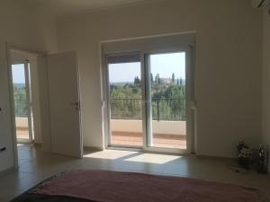 Postel nebo postele na pokoji v ubytování Hillside Villa