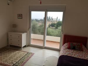 Postel nebo postele na pokoji v ubytování Hillside Villa
