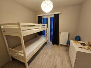 Krevet ili kreveti u jedinici u okviru objekta Côte à l'Oostduinkerke met gratis garage