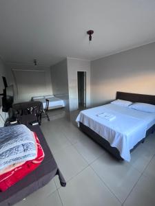 Postel nebo postele na pokoji v ubytování Ciity Hotel ijui