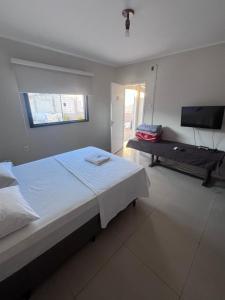 Postel nebo postele na pokoji v ubytování Ciity Hotel ijui