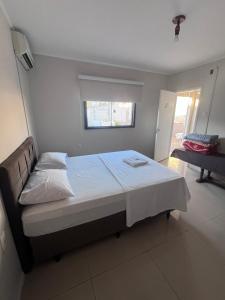 Postel nebo postele na pokoji v ubytování Ciity Hotel ijui