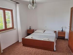 Posteľ alebo postele v izbe v ubytovaní Apartments MOST