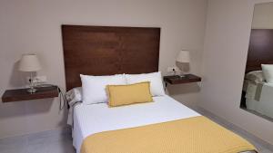 A bed or beds in a room at Casa Rivas