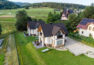 an overhead view of a house with a solar roof at Modrzewiowa Ostoja in Kluszkowce