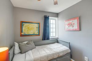 a bedroom with a bed and a window at Arlington Townhome with Furnished Patio! in Arlington