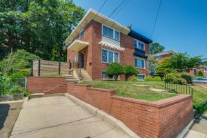 a brick house with a brick wall at Arlington Townhome with Furnished Patio! in Arlington